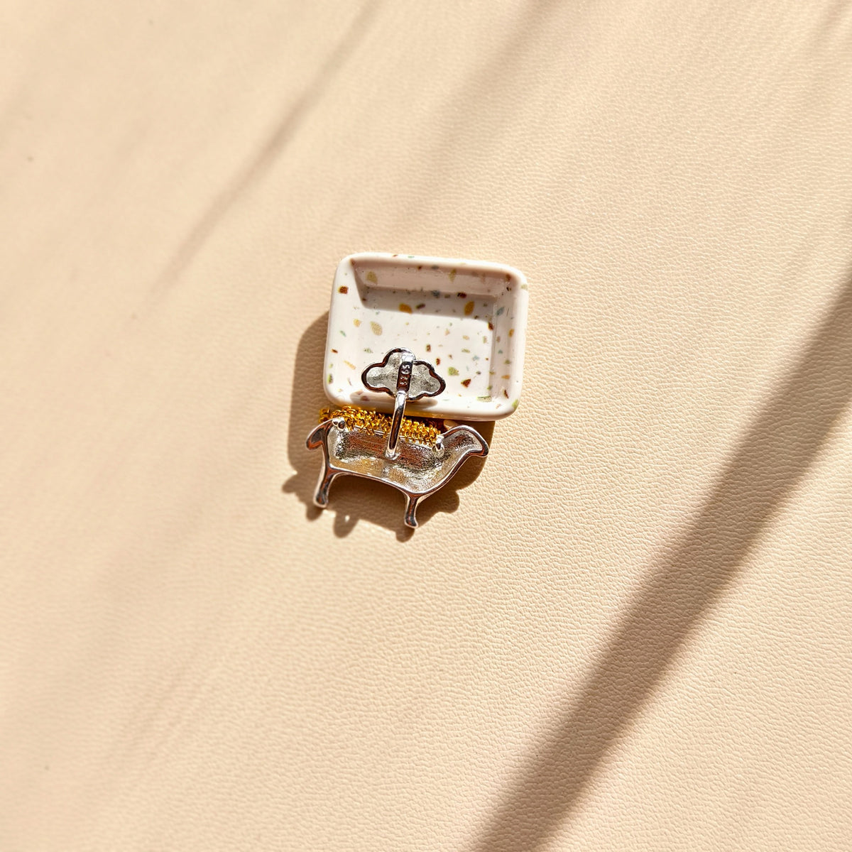 Reverse of cloud and lamb pendant showing the S925 mark