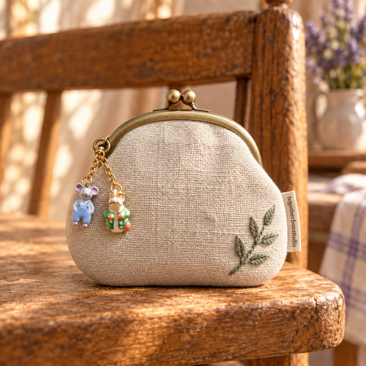 Miniature mouse charms styled on a small purse; purse and additional fittings not included