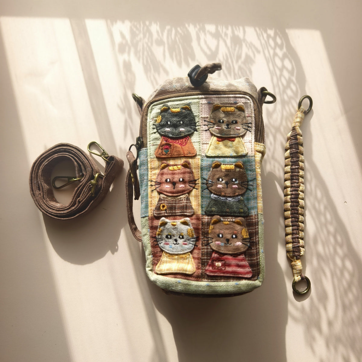 Actual meadow cat bottle bag with included short handle and adjustable long strap