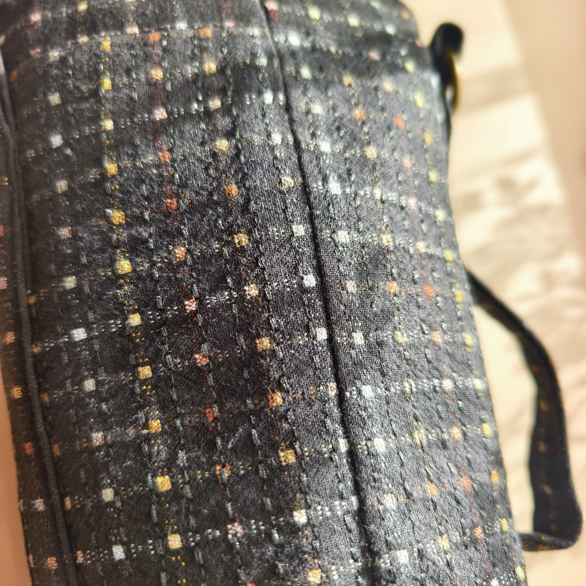 Navy fabric texture and small multicoloured woven flecks